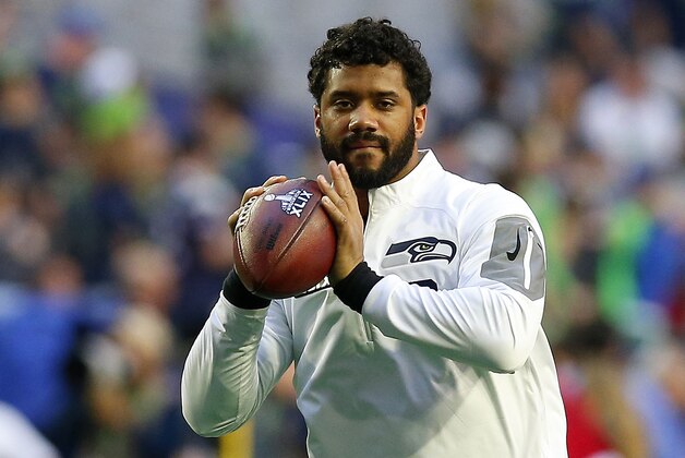 GLENDALE, AZ - FEBRUARY 01:  Russell Wilson #3 of the Seattle Seahawks prepares for Super Bowl XLVIII between the Seattle Seahawks and the New England Patriots at University of Phoenix Stadium on February 1, 2015 in Glendale, Arizona.  (Photo by Tom Pennington/Getty Images)