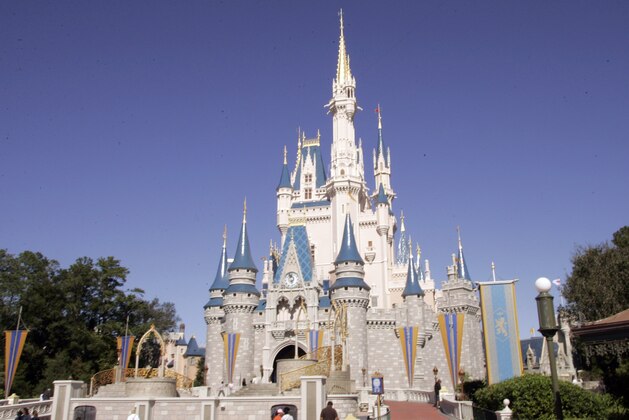 FILE-  This Jan. 26, 2006 file photo shows Cinderella's Castle at Walt Disney World's Magic Kingdom in Lake Buena Vista, Fla. Fans have been traveling to Central and South Florida for decades to get a glimpse of veteran stars and new prospects alike during spring training. Orlando is the theme park capital of the world, of course, so baseball fans can also check out Disney World, SeaWorld, Universal Studios and other attractions.    (AP Photo/Reinhold Matay, FILE)