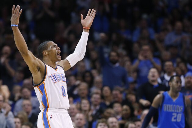 Oklahoma City Thunder guard Russell Westbrook (0) gestures to the crowd following a dunk in the first quarter of an NBA basketball game against the Dallas Mavericks in Oklahoma City, Thursday, Feb. 19, 2015. (AP Photo/Sue Ogrocki)