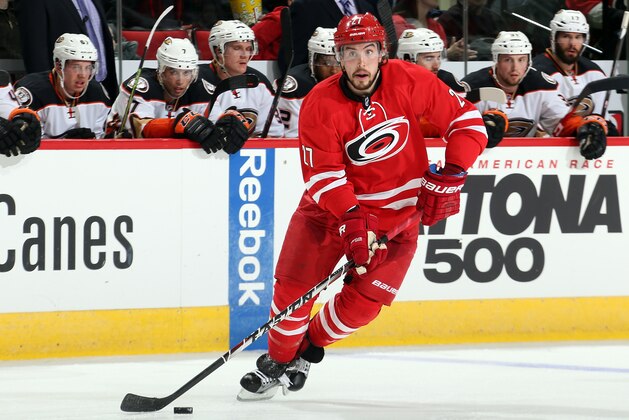 RALEIGH, NC - FEBRUARY 12: Justin Faulk #27 of the Carolina Hurricanes controls the puck on the ice during their NHL game against the Anaheim Ducks at PNC Arena on Febuary 12, 2015 in Raleigh, North Carolina.  (Photo by Gregg Forwerck/NHLI via Getty Images)