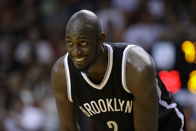 Brooklyn Nets forward Kevin Garnett stand son the court during the first half of an NBA basketball game against the Miami Heat, Sunday, Jan. 4, 2015, in Miami. (AP Photo/Lynne Sladky)