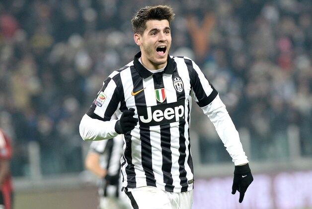Juventus forward Alvaro Morata celebrates after scoring his side's third goal during a Serie A soccer match between Juventus and AC Milan at the Juventus stadium, in Turin, Italy, Sunday, Feb. 7, 2015. (AP Photo/Massimo Pinca)