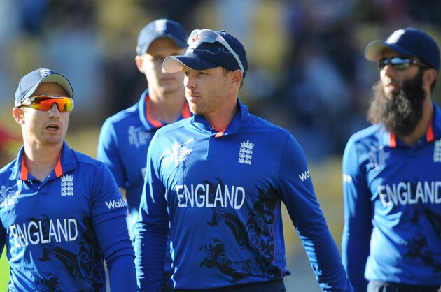 England players James Taylor, left, and Ian Bell walk with teammates from the field following their seven wicket loss to New Zealand after their Cricket World Cup match in Wellington, New Zealand, Friday Feb. 20, 2015. (AP Photo/Ross Setford)