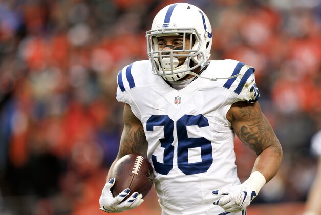 Indianapolis Colts running back Dan Herron celebrates as he runs to the bench after scoring a touchdown against the Denver Broncos during the first half of an NFL divisional playoff football game, Sunday, Jan. 11, 2015, in Denver. (AP Photo/David Zalubowski)