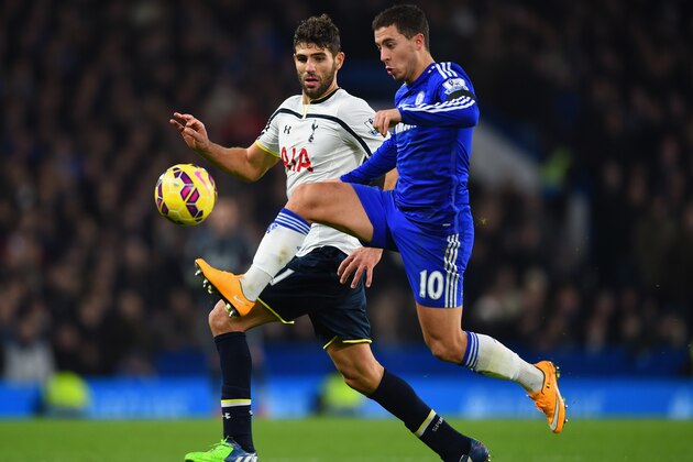 LONDON, ENGLAND - DECEMBER 03:  Eden Hazard of Chelsea controls the ball under pressure from Federico Fazio of Spurs during the Barclays Premier League match between Chelsea and Tottenham Hotspur at Stamford Bridge on December 3, 2014 in London, England.  (Photo by Shaun Botterill/Getty Images)
