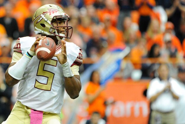Oct 11, 2014; Syracuse, NY, USA; Florida State Seminoles quarterback Jameis Winston (5) drops back to pass against the Syracuse Orange during the second quarter at the Carrier Dome.  Florida State defeated Syracuse 38-20.  Mandatory Credit: Rich Barnes-USA TODAY Sports