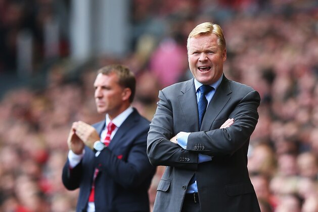 LIVERPOOL, ENGLAND - AUGUST 17: Ronald Koeman, manager of Southampton gives instructions with Brendan Rodgers, manager of Liverpool during the Barclays Premier League match between Liverpool and Southampton at Anfield on August 17, 2014 in Liverpool, England.  (Photo by Alex Livesey/Getty Images)