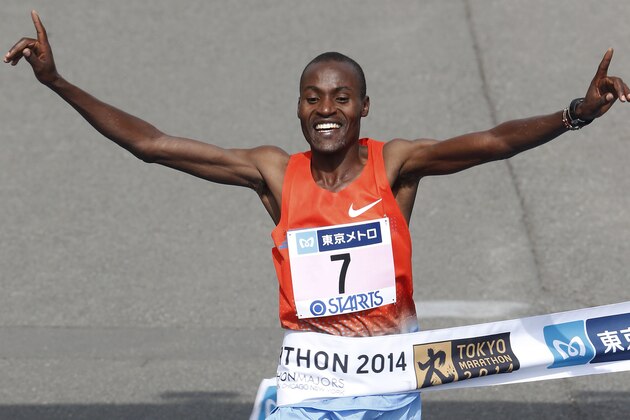Dickson Chumba of Kenya crosses the finish line to win the men's race of the Tokyo Marathon in Tokyo Sunday, Feb. 23, 2014. (AP Photo/Shizuo Kambayashi, Pool)