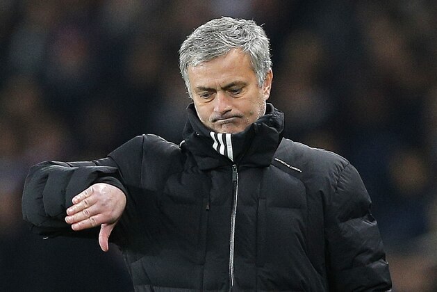 Chelsea manager Jose Mourinho gestures during the Champions League round of 16 first leg soccer match between Paris Saint Germain and Chelsea at the Parc des Princes stadium in Paris, France, Tuesday, Feb. 17, 2015. (AP Photo/Christophe Ena)