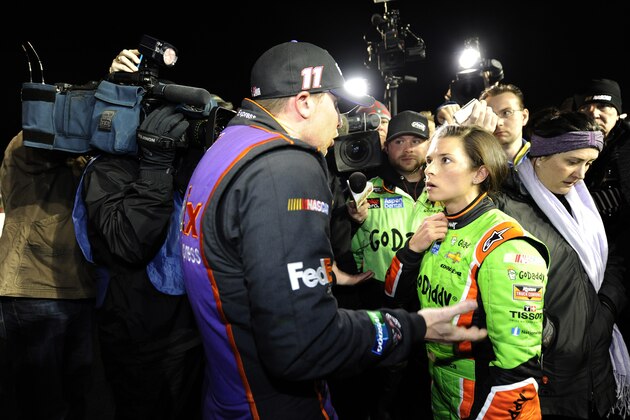 DAYTONA BEACH, FL - FEBRUARY 19:  Danica Patrick, driver of the #10 GoDaddy Chevrolet, and Denny Hamlin, driver of the #11 FedEx Express Toyota, talk about their in-race incident on pit road after the the NASCAR Sprint Cup Series Budweiser Duel 2 at Daytona International Speedway on February 19, 2015 in Daytona Beach, Florida.  (Photo by Jared C. Tilton/Getty Images)