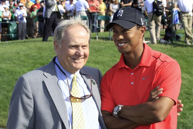 Jack Nicklaus, left, and Tiger Woods talk after Woods won the Memorial golf tournament at the Muirfield Village Golf Club in Dublin, Ohio, Sunday, June 3, 2012. (AP Photo/Tony Dejak)