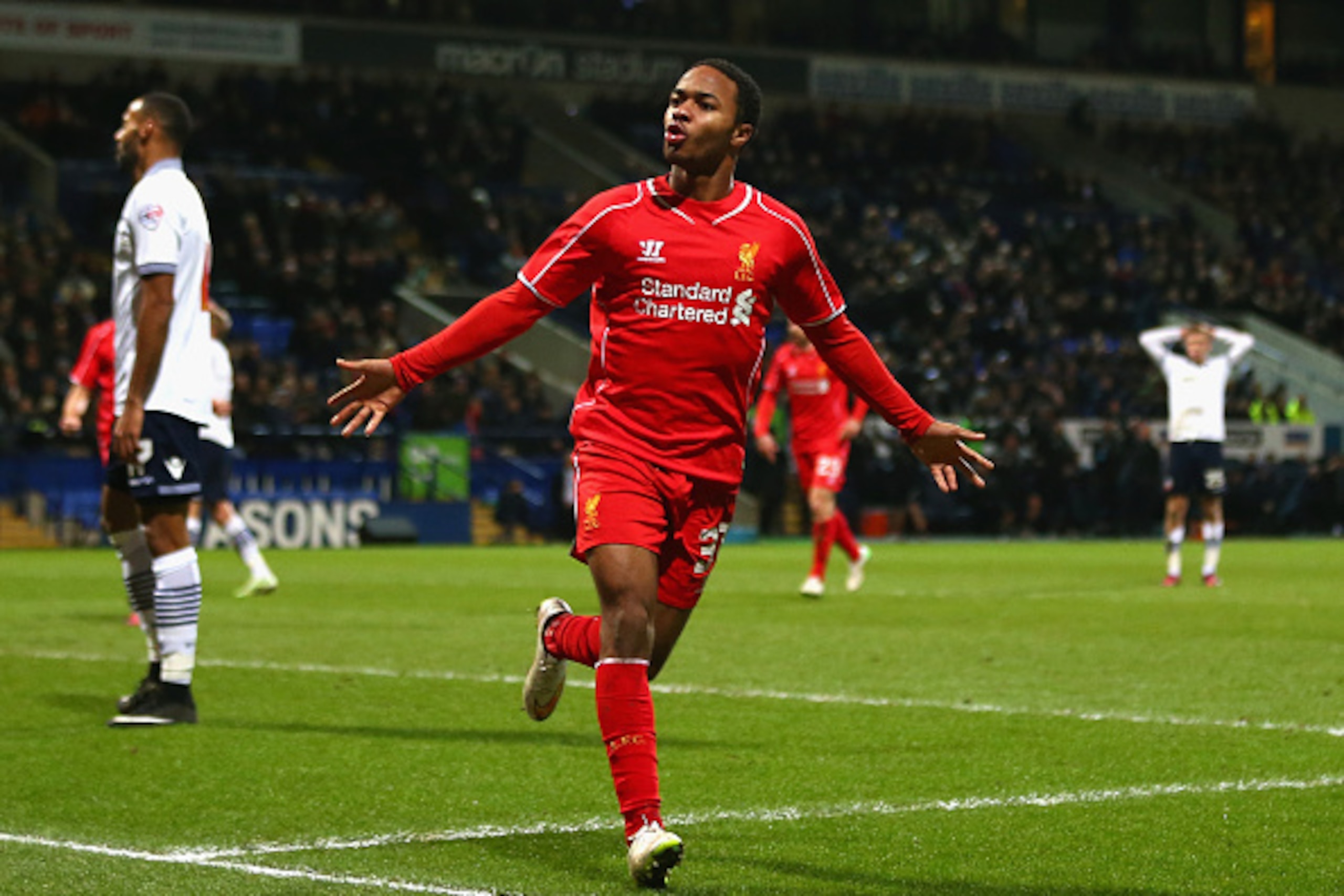 BOLTON, ENGLAND - FEBRUARY 04:  Raheem Sterling of Liverpool celebrates scoring their first goal  during the FA Cup Fourth round replay between Bolton Wanderers and Liverpool at Macron Stadium on February 4, 2015 in Bolton, England.  (Photo by Michael Steele/Getty Images)