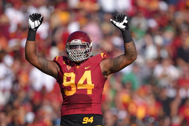 Southern California defensive end Leonard Williams gestures to fans during the first half an NCAA college football game against Notre Dame, Saturday, Nov. 29, 2014, in Los Angeles. Southern California won 49-14. (AP Photo/Mark J. Terrill)