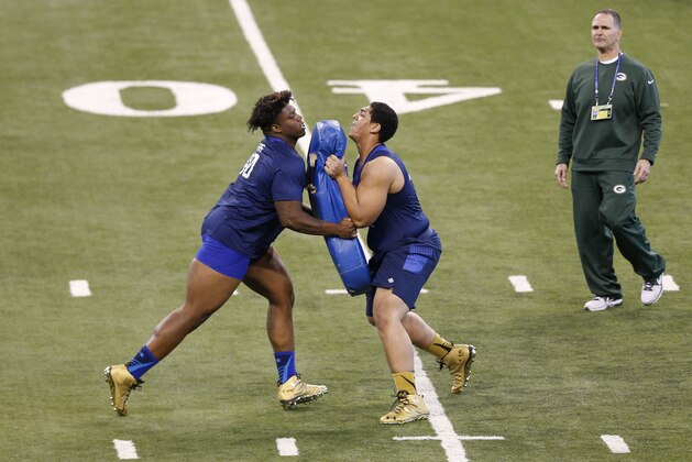 INDIANAPOLIS, IN - FEBRUARY 20: Offensive linemen Andrus Peat (right) of Stanford competes with Robert Myers of Tennessee State during the 2015 NFL Scouting Combine at Lucas Oil Stadium on February 20, 2015 in Indianapolis, Indiana. (Photo by Joe Robbins/Getty Images)