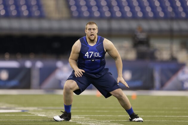 Iowa offensive lineman Brandon Scherff runs a drill at the NFL football scouting combine in Indianapolis, Friday, Feb. 20, 2015. (AP Photo/David J. Phillip)