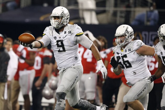 Oregon's Arik Armstead reacts after recovering a fumble during the second half of the NCAA college football playoff championship game against Ohio State Monday, Jan. 12, 2015, in Arlington, Texas. (AP Photo/Brandon Wade)