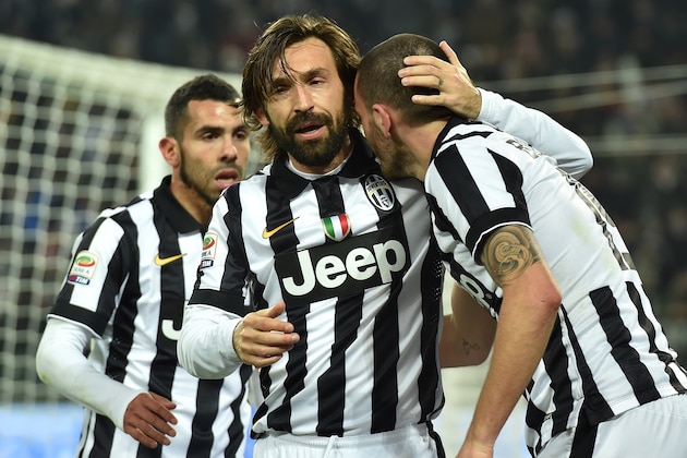 TURIN, ITALY - FEBRUARY 07:  Leonardo Bonucci (R) of Juventus FC celebrates a goal with team mate Andrea Pirlo during the Serie A match between Juventus FC and AC Milan at Juventus Arena on February 7, 2015 in Turin, Italy.  (Photo by Valerio Pennicino/Getty Images)