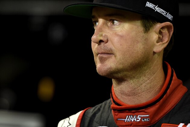 HOMESTEAD, FL - NOVEMBER 14:  Kurt Busch, driver of the #41 Haas Automation Chevrolet, stands on the grid during qualifying for the NASCAR Sprint Cup Series Ford EcoBoost 400 at Homestead-Miami Speedway on November 14, 2014 in Homestead, Florida.  (Photo by Patrick Smith/Getty Images)