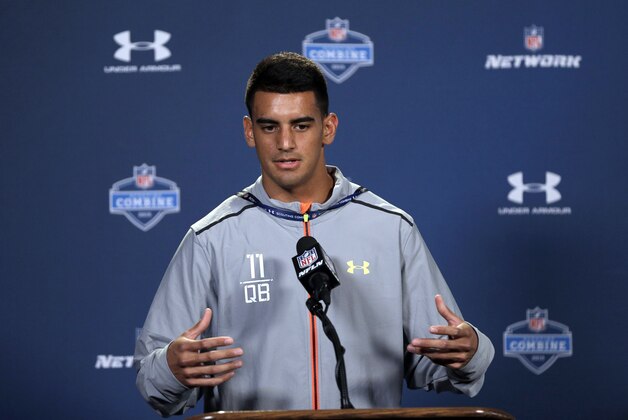 Oregon quarterback Marcus Mariota answers a question during a news conference at the NFL football scouting combine in Indianapolis, Thursday, Feb. 19, 2015. (AP Photo/David J. Phillip)