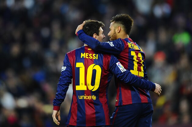 FC Barcelona's Lionel Messi, from Argentina, left, reacts after scoring with his teammate Neymar, from Brazil, against Levante during a Spanish La Liga soccer match at the Camp Nou stadium in Barcelona, Spain, Sunday, Feb. 15, 2015. (AP Photo/Manu Fernandez)