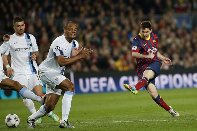 Barcelona's Lionel Messi, right shoots on goal during a Champions League, round of 16, second leg, soccer match between FC Barcelona and Manchester City at the Camp Nou Stadium in Barcelona, Spain, Wednesday March 12, 2014. (AP Photo/Emilio Morenatti)