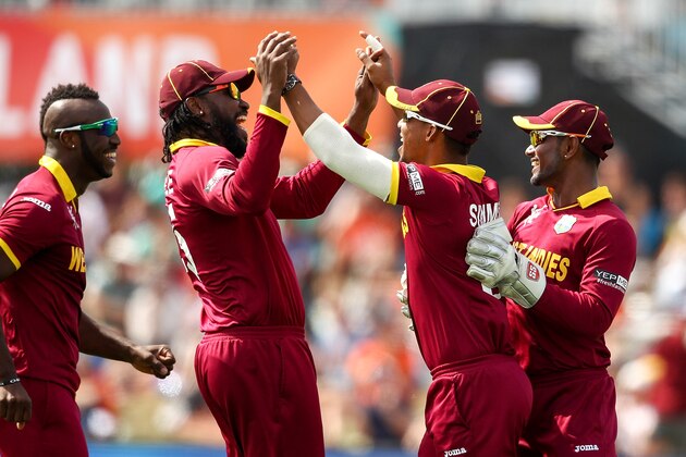 CHRISTCHURCH, NEW ZEALAND - FEBRUARY 21:  Lendl Simmons (C) of West Indies celebrates with team mates after taking a catch during the 2015 ICC Cricket World Cup match between Pakistan and the West Indies at Hagley Oval on February 21, 2015 in Christchurch, New Zealand.  (Photo by Martin Hunter/Getty Images)