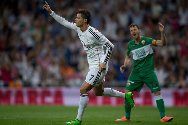 MADRID, SPAIN - SEPTEMBER 23: Cristiano Ronaldo of Real Madrid CF celebrates scoring their third goal during the La Liga match between Real Madrid CF and Elche CF at Estadio Santiago Bernabeu on September 23, 2014 in Madrid, Spain.  (Photo by Gonzalo Arroyo Moreno/Getty Images)