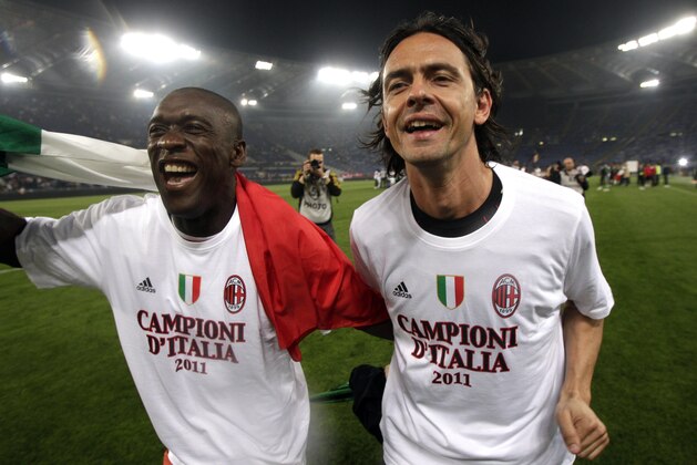 FILE -- In this file photo taken on May 7, 2011, AC Milan's Clarence Seedorf, left, and  Filippo Inzaghi celebrate after the Serie A soccer match between AS Roma and AC Milan at Rome's Olympic stadium. Real Madrid's Champions League winning coach, Carlo Ancelotti, has backed former player Filippo Inzaghi as the ideal candidate to take over as manager of AC Milan.Current Milan coach Clarence Seedorf is only four months into a 2 ½ year contract, but Italian media reports claim that club owner Silvio Berlusconi has already decided to replace him with the Dutchman's former teammate, Inzaghi. (AP Photo/Pier Paolo Cito)