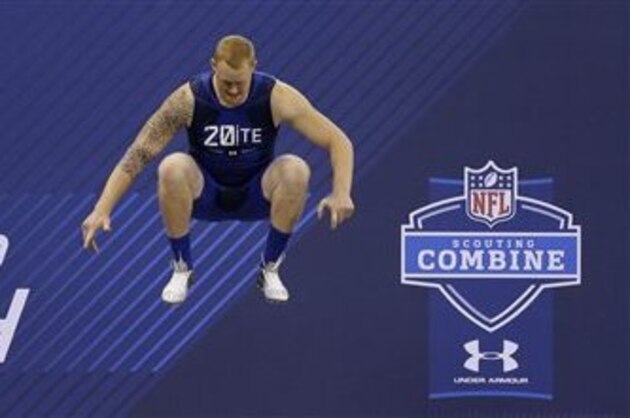 Minnesota tight end Maxx Williams jumps as he prepares to run the 40-yard dash at the NFL football scouting combine in Indianapolis, Friday, Feb. 20, 2015. (AP Photo/David J. Phillip)
