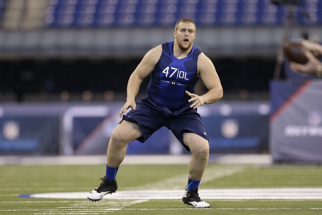 Iowa offensive lineman Brandon Scherff runs a drill at the NFL football scouting combine in Indianapolis, Friday, Feb. 20, 2015. (AP Photo/David J. Phillip)