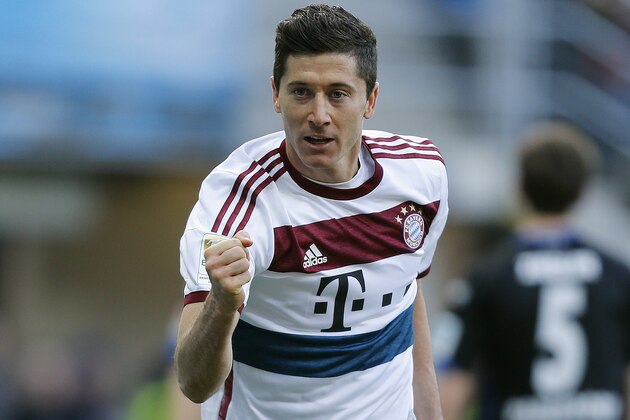 Bayern's Robert Lewandowski from Poland celebrates after scoring  during the German first division Bundesliga soccer match between SC Paderborn and Bayern Munich in Paderborn, Germany, Saturday, Feb. 21, 2015. (AP Photo/Frank Augstein)