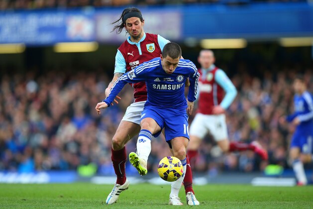 LONDON, ENGLAND - FEBRUARY 21:  Eden Hazard of Chelsea is challenged by George Boyd of Burnley during the Barclays Premier League match between Chelsea and Burnley at Stamford Bridge on February 21, 2015 in London, England.  (Photo by Paul Gilham/Getty Images)