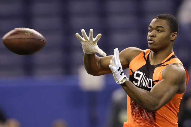 Alabama wide receiver Amari Cooper catches a pass during a drill at the NFL football scouting combine in Indianapolis, Saturday, Feb. 21, 2015. (AP Photo/David J. Phillip)