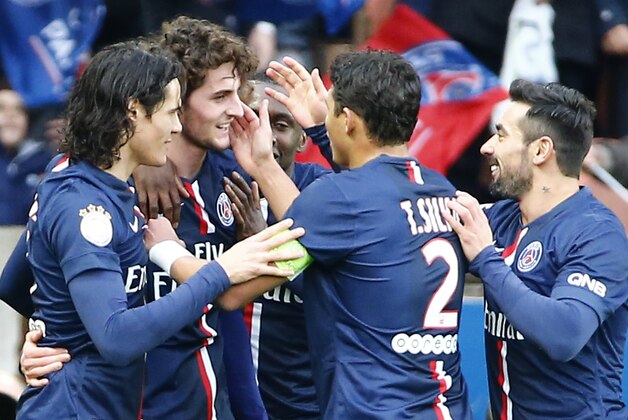 PSG's Adrien Rabiot, 2nd left, celebrates with teamates  after scoring against Toulouse FC during his French League one soccer match at the  Parc des Princes stadium, in Paris, France, Saturday, Feb. 21, 2015. (AP Photo/Jacques Brinon)