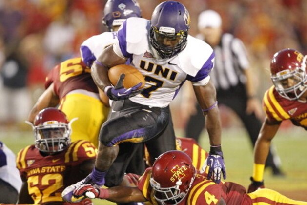 AMES, IA - AUGUST 31:Running back David Johnson #7 of the Northern Iowa Panthers jumps up and over defensive back Sam E. Richardson #4 of the Iowa State Cyclones in the first half of play at Jack Trice Stadium on August 31, 2013 in Ames, Iowa. Northern Iowa defeated Iowa State Cyclones 28-20. (Photo by David K Purdy/Getty Images)