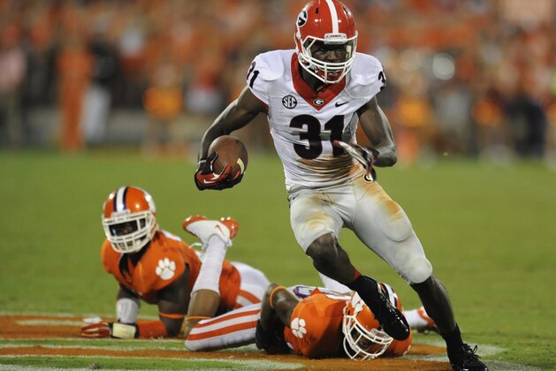 Georgia's Chris Conley is pursued by Clemson's Robert Smith, left, and Garry Peters during the second half of an NCAA college football game Saturday, Aug. 31, 2013 at Memorial Stadium in Clemson, S.C.(AP Photo/ Richard Shiro)