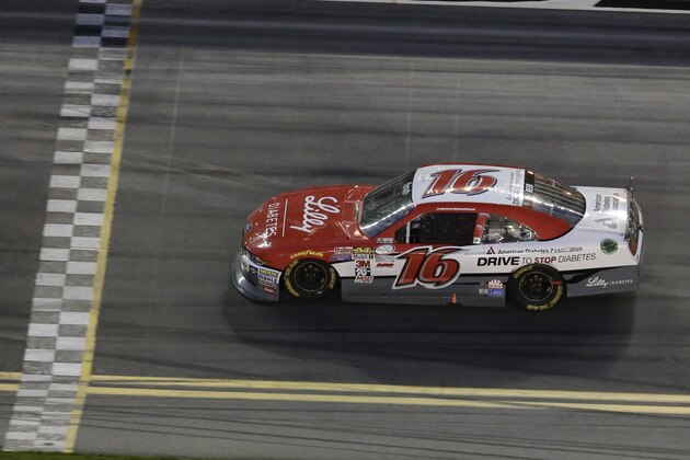 Ryan Reed (16) heads to the finish line to win the Xfinity series auto race at Daytona International Speedway, Saturday, Feb. 21, 2015, in Daytona Beach, Fla. (AP Photo/John Raoux)