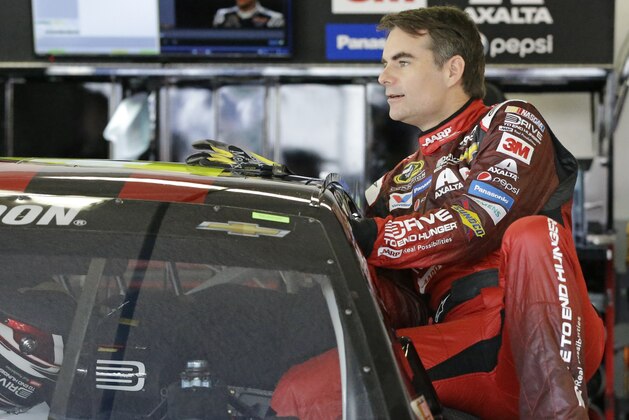 Jeff Gordon climbs in his car to prepare for  a practice for the Daytona 500 NASCAR Sprint Cup series auto race at Daytona International Speedway, Saturday, Feb. 21, 2015, in Daytona Beach, Fla. Gordon will start the Daytona 500 at the pole position. (AP Photo/John Raoux)