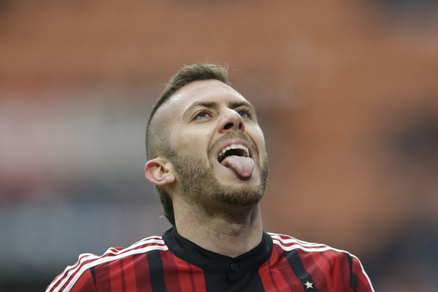 AC Milan's Jeremy Menez sticks his tongue out after missing a chance to score during a Serie A soccer match between AC Milan and Empoli, at the San Siro stadium in Milan, Italy, Sunday, Feb.15, 2015. (AP Photo/Luca Bruno)