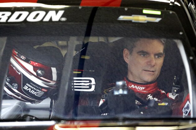 Jeff Gordon sits in his car to waiting for the start of a practice for the Daytona 500 NASCAR Sprint Cup series auto race at Daytona International Speedway, Saturday, Feb. 21, 2015, in Daytona Beach, Fla. Gordon will start the Daytona 500 in the pole position. (AP Photo/John Raoux)