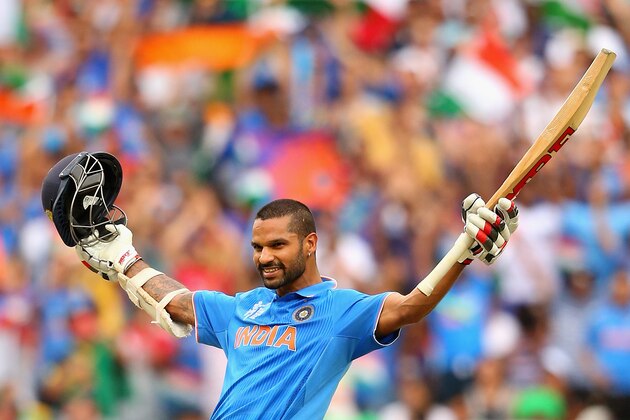 MELBOURNE, AUSTRALIA - FEBRUARY 22:  Shikhar Dhawan of India celebrates making a century during the 2015 ICC Cricket World Cup match between South Africa and India at Melbourne Cricket Ground on February 22, 2015 in Melbourne, Australia.  (Photo by Quinn Rooney/Getty Images)