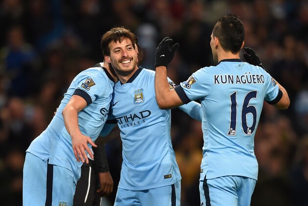 MANCHESTER, ENGLAND - FEBRUARY 21:  David Silva of Manchester City celebrates scoring their fourth goal  with Sergio Aguero and Samir Nasri during the Barclays Premier League match between Manchester City and Newcastle United at Etihad Stadium on February 21, 2015 in Manchester, England.  (Photo by Michael Regan/Getty Images)