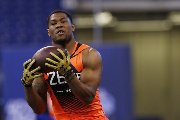 Michigan State running back Jeremy Langford runs a drill at the NFL football scouting combine in Indianapolis, Saturday, Feb. 21, 2015. (AP Photo/Julio Cortez)