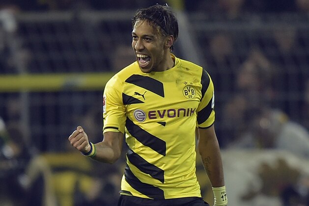 Dortmund's scorer Pierre-Emerick Aubameyang from Gabon celebrates during the German Bundesliga soccer match between Borussia Dortmund and FSV Mainz in Dortmund, Germany, Friday, Feb. 13, 2015. (AP Photo/Martin Meissner)
