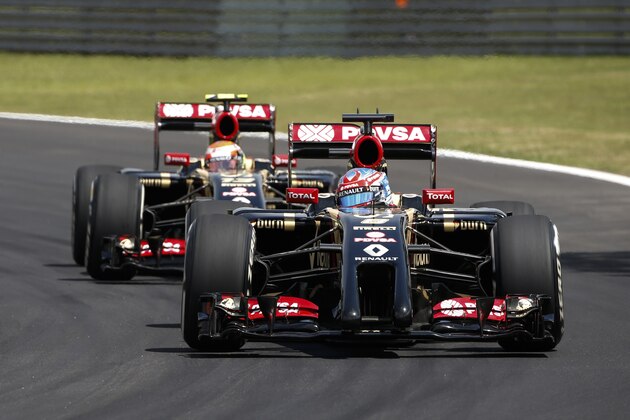 Lotus driver Romain Grosjean, of France, steers his car followed by teammate Pastor Maldonado during a Formula One free practice at the Interlagos race track in Sao Paulo, Brazil, Friday, Nov. 7, 2014. F1 teams are in Sao Paulo to compete in Sunday's 2014 Brazilian Grand Prix. (AP Photo/Andre Penner)