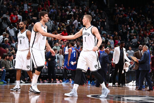 BROOKLYN, NY - JANUARY 9:  Brook Lopez #11 and Mason Plumlee #1 of the Brooklyn Nets celebrate during the game against the Philadelphia 76ers on January 9, 2015 at Barclays Center in Brooklyn, New York. NOTE TO USER: User expressly acknowledges and agrees that, by downloading and or using this Photograph, user is consenting to the terms and conditions of the Getty Images License Agreement. Mandatory Copyright Notice: Copyright 2015 NBAE (Photo by Nathaniel S. Butler/NBAE via Getty Images)