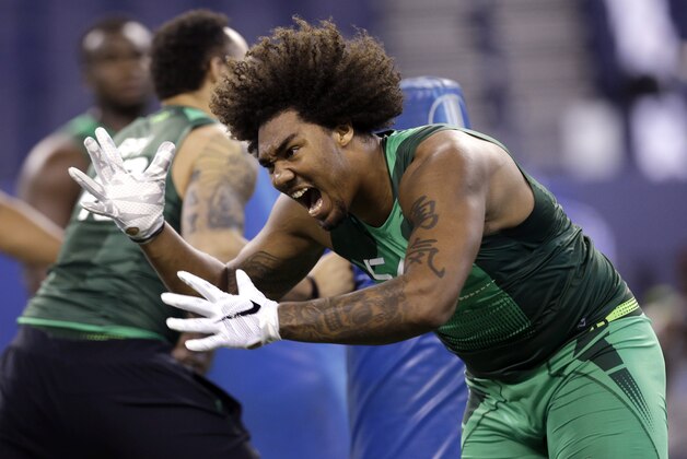 Southern California defensive lineman Leonard Williams yells while running through a drill at the NFL football scouting combine in Indianapolis, Sunday, Feb. 22, 2015. (AP Photo/David J. Phillip)