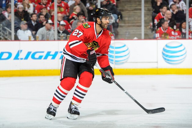 CHICAGO, IL - JANUARY 06:  Johnny Oduya #27 of the Chicago Blackhawks looks up the ice  during the NHL game against the Colorado Avalanche at the United Center on January 6, 2015 in Chicago, Illinois.  (Photo by Bill Smith/NHLI via Getty Images)