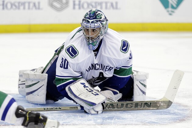 Vancouver Canucks goalie Ryan Miller (30) watches the play against the Tampa Bay Lightning during the second period of an NHL hockey game Tuesday, Jan. 20, 2015, in Tampa, Fla. (AP Photo/Chris O'Meara)