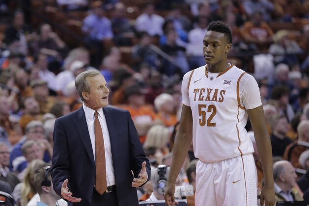 Texas head coach Rick Barnes, left, talks with Myles Turner (52) during the second half of an NCAA college basketball game against Oklahoma State, Wednesday, Feb. 4, 2015, in Austin, Texas. Oklahoma State won in overtime 65-63. (AP Photo/Eric Gay)